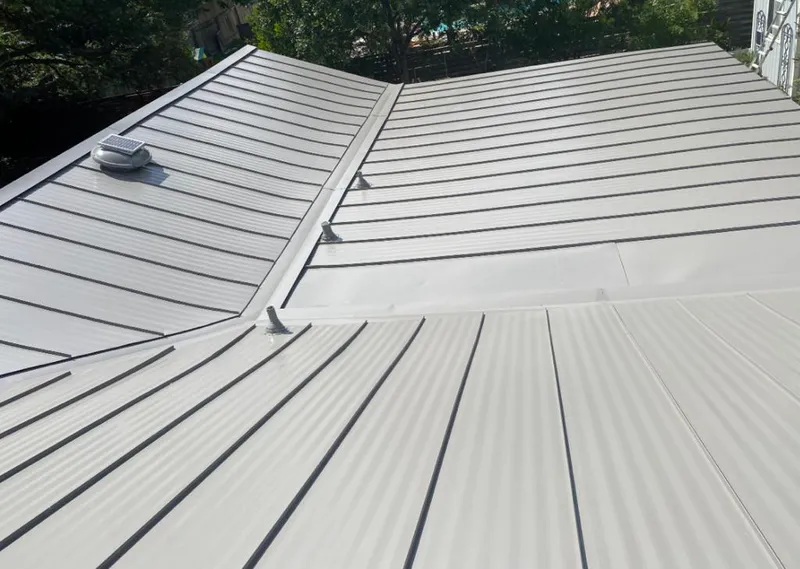 Solar attic fan installed on a metal roof for Roof Ventilation in Chillum